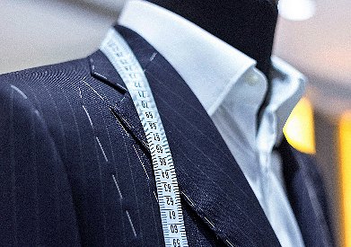 Kim Tailor & Cleaners logo