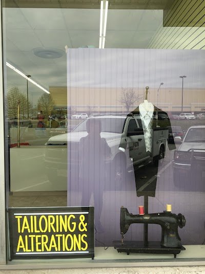 Kim's Tailoring & Cleaners logo