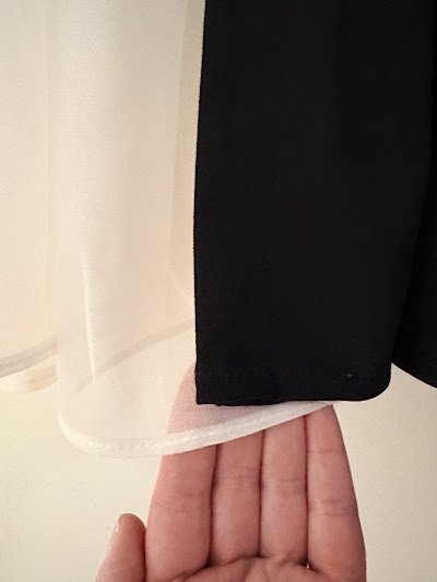 Universal Tailors logo